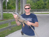 Dr. Johnson with invasive iguana
